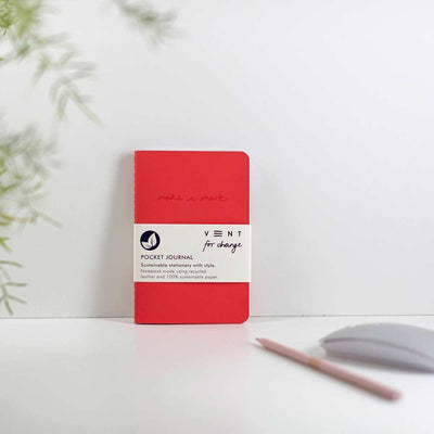 recycled leather pocket journal in red on a desk