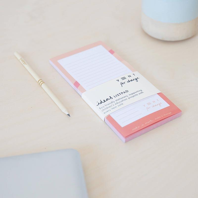 pink recycled paper list pad on kitchen side