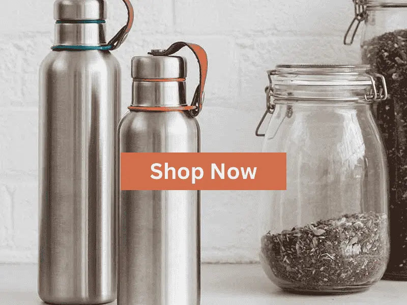 Stainless steel water bottles with leather straps next to glass jars | Friendly Turtle