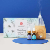 nebuslising aromatherapy oil diffuser on blue background