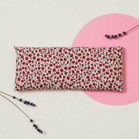eye pillow with red berries printed on it