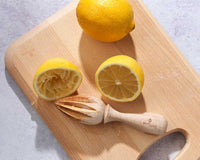 lemon on a wooden chopping board