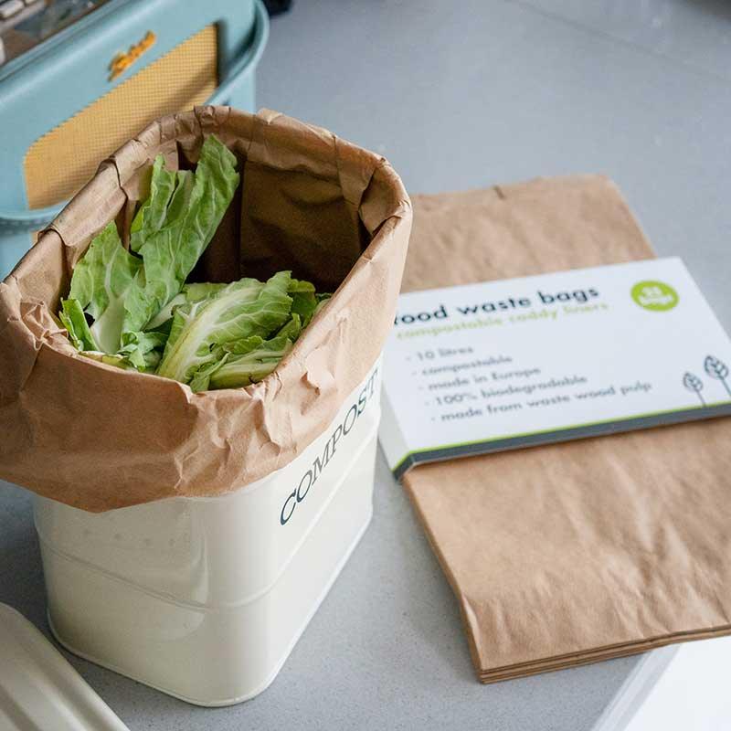compostable food waste bags inside a compost bin