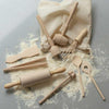 mini cooking utensil set with a pile of flour