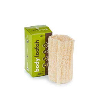 natural body loofah next to packaging