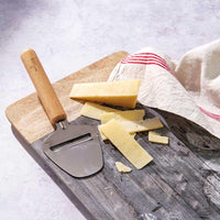 wooden cheese slicer on a chopping board