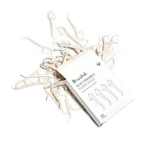 eco friendly floss picks in a pile