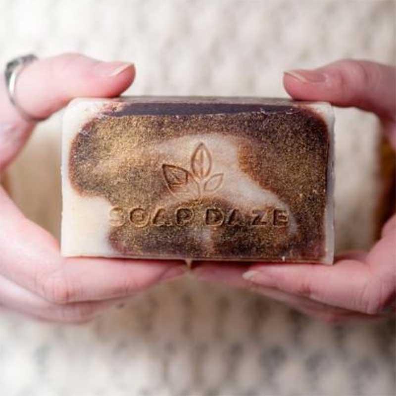 unboxed large natural soap bar in ladies hand