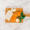 lime basil and mandarin soy wax melts on a chopping board