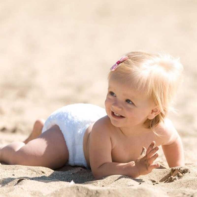 baby crawling on the sand