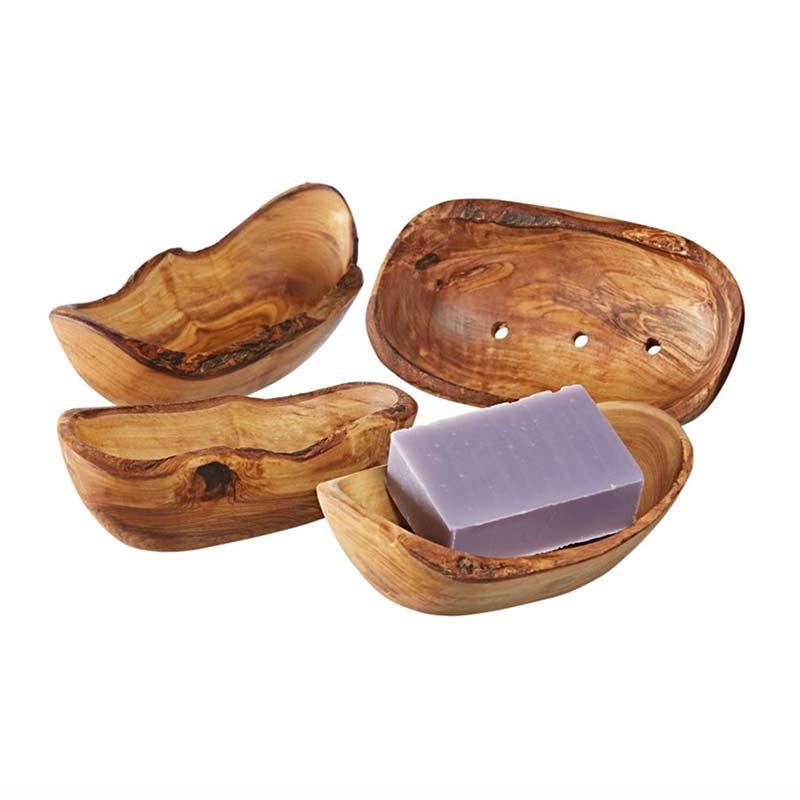 4 wooden soap dishes on white background