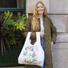 woman holding fruits / cabana reusable shopping bag