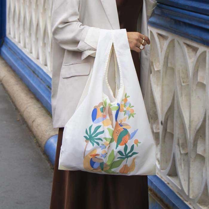 woman with fruits / cabana reusable shopping bag