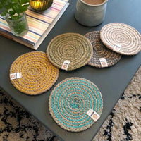 collection of jute coasters on a coffee table