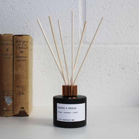 reed diffuser with orange and chilli
