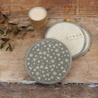organic cotton facial pads on a wooden table
