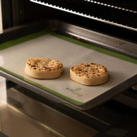 crumpets on a reusable baking sheet