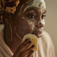 woman using a reusable makeup pad