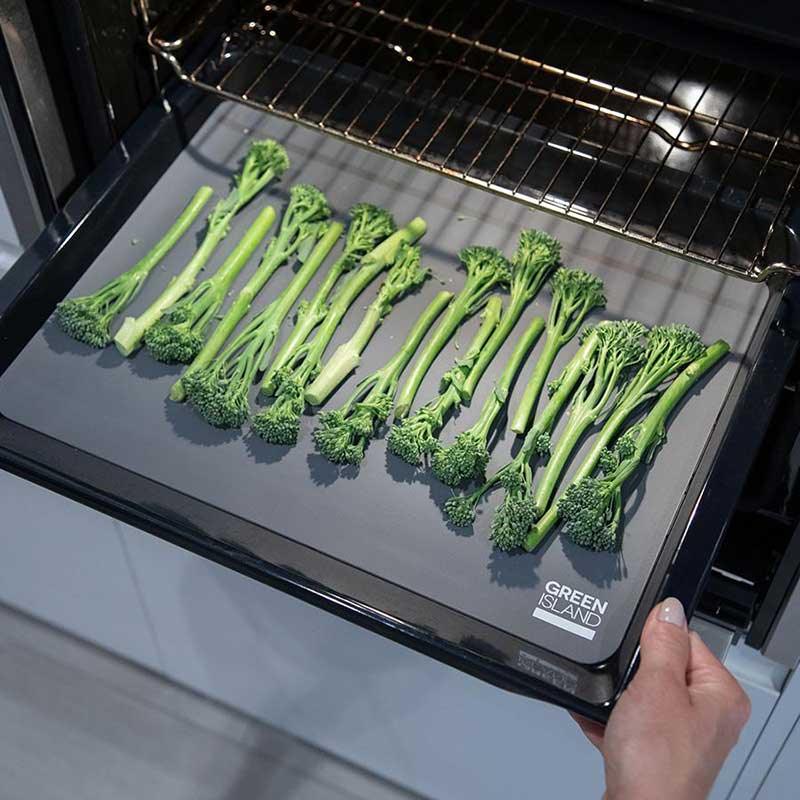 reusable silicone baking mat with broccoli on top