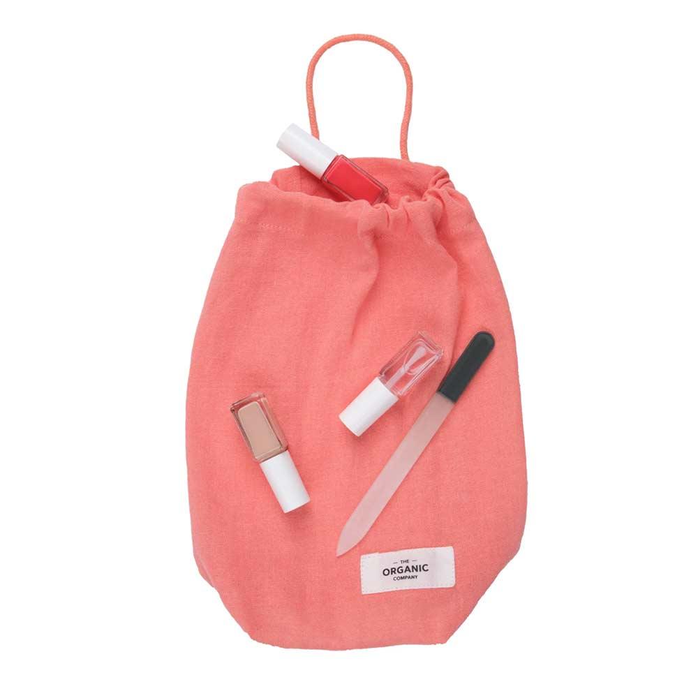 small drawstring bag with nail bits on top