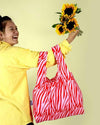 reusable bag over a woman's arms